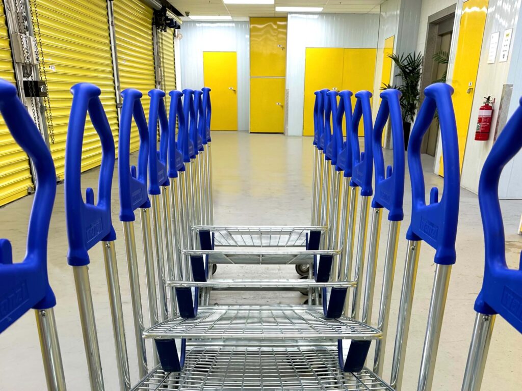 Undercover loading dock at Wellington storage featuring trolleys for customer use, highlighting the ease of moving items.