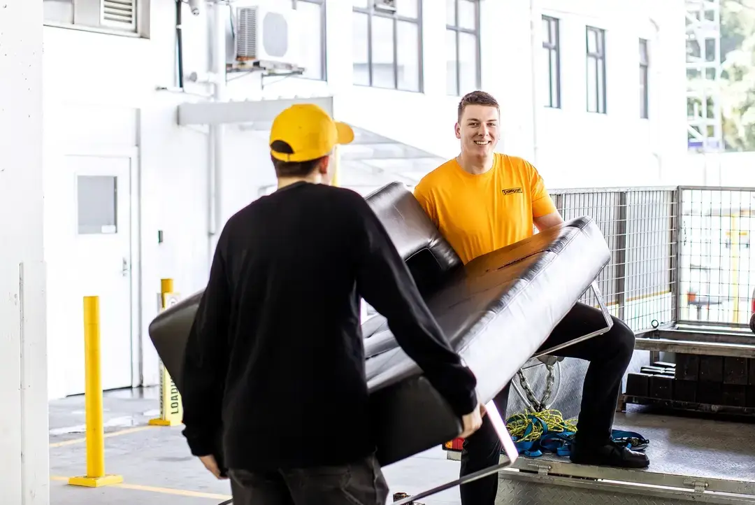 Man carrying a mattress while moving